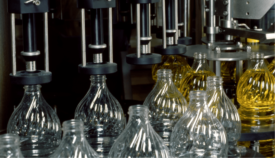 image of bottles being filled in factory