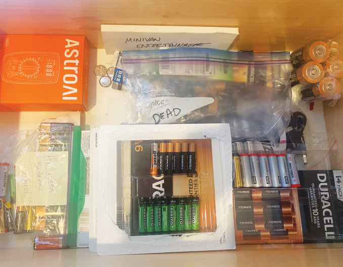 A drawer of batteries sorted from new/unused at the front, to partially used, then “ready for recycling” in the back.